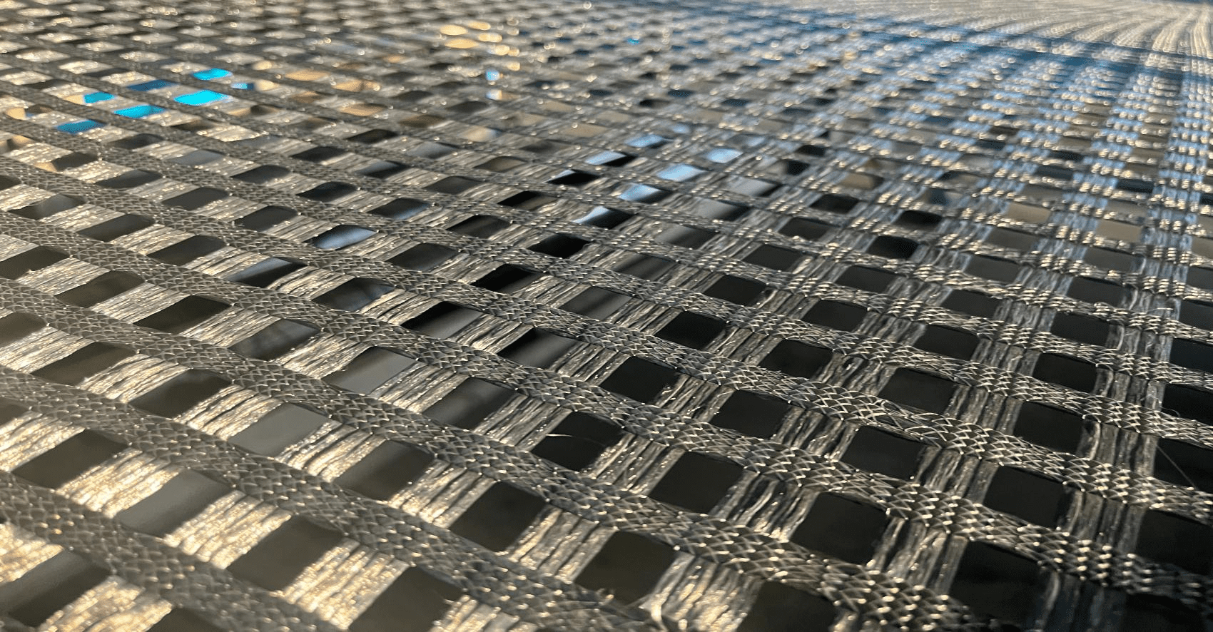 polyester biaxial geogrid,PET biaxial geogrid,road base reinforcement geogrid,soil stabilization grid